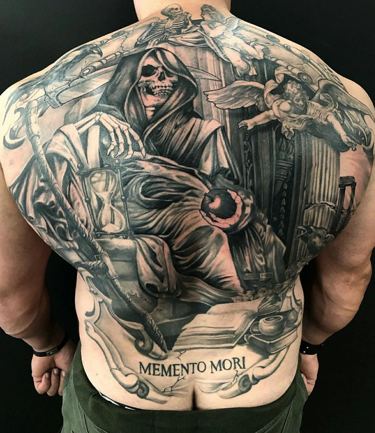 memento mori back tattoo: An extensive "memento mori" tattoo designed for the back, allowing for a larger, more detailed depiction.