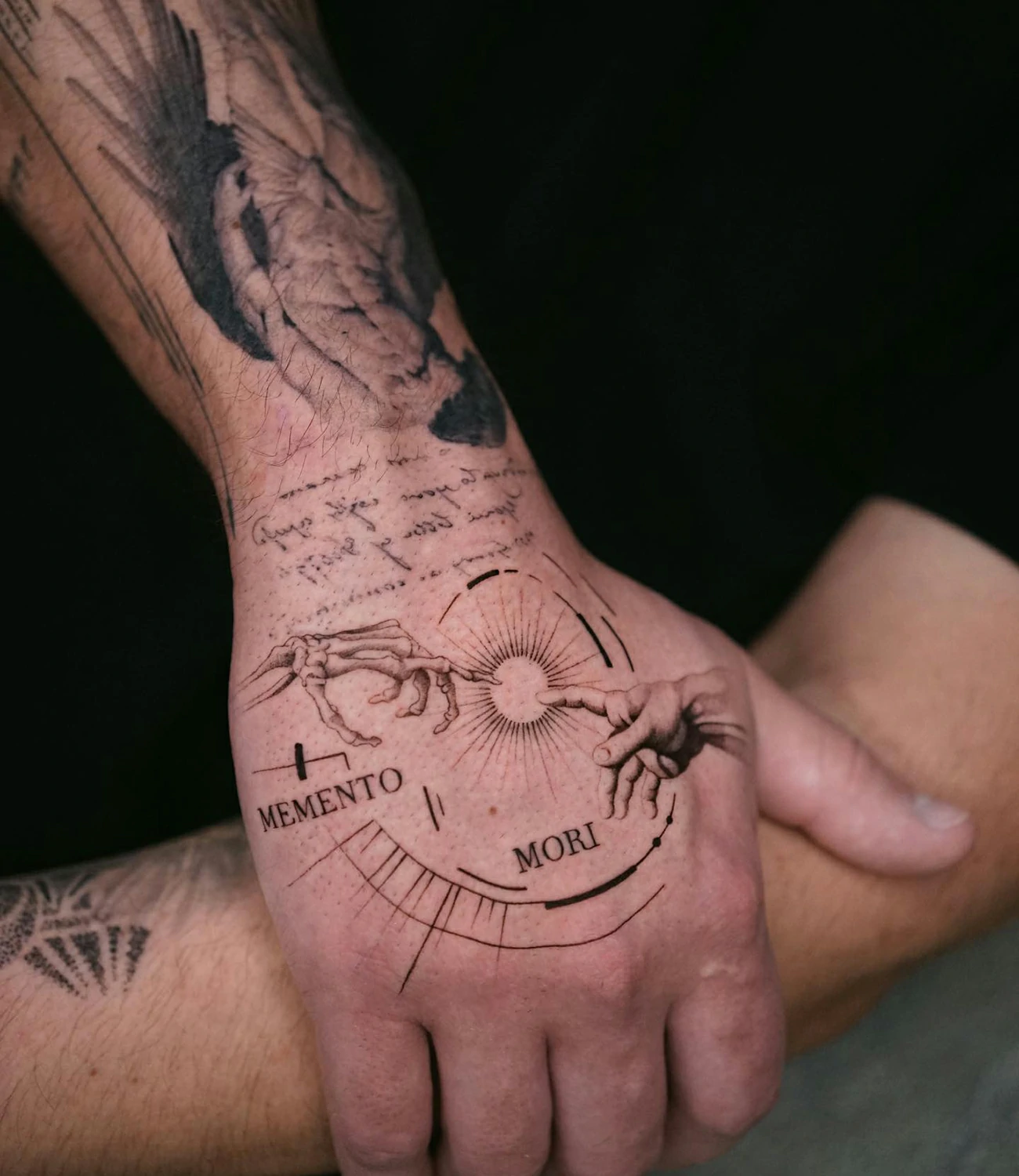 memento mori stoic tattoo: A tattoo reflecting Stoic philosophy, with "memento mori" and symbols or quotes from Stoicism.
