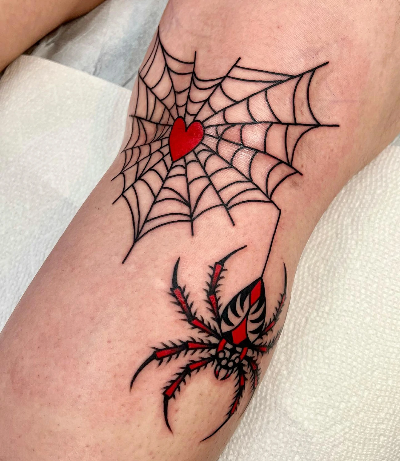 spider web knee tattoo