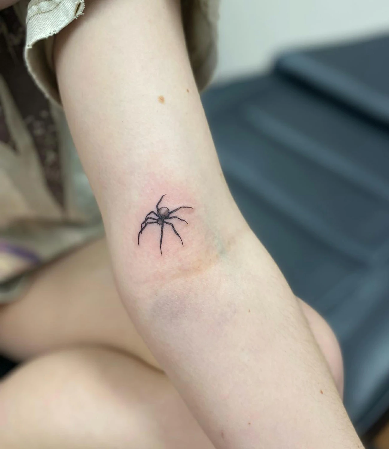 Small spider tattoo