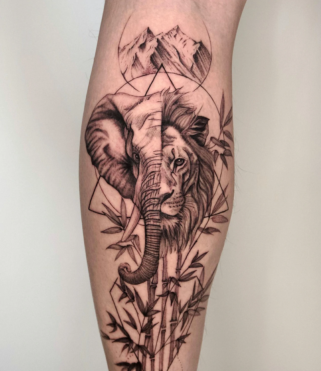 Lion and Elephant Tattoo