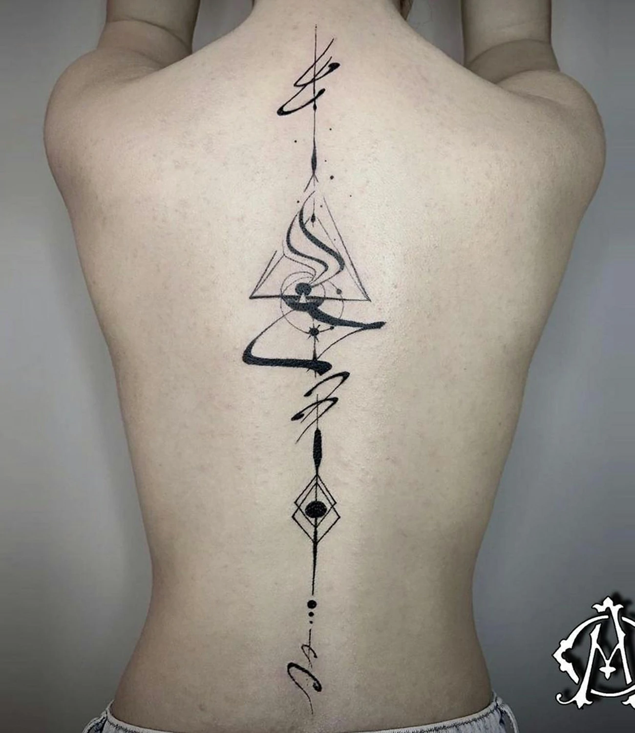 Arrow Tattoo on Spine