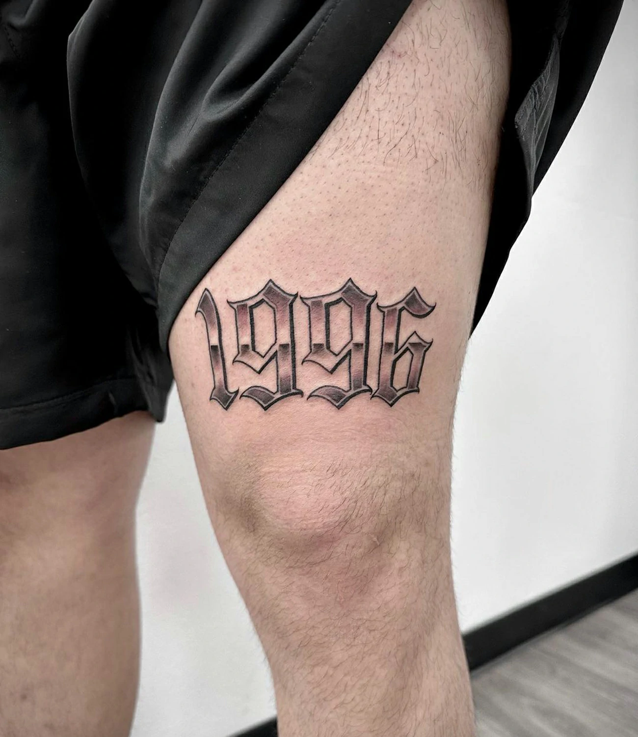 Birth Year Tattoo Above Knee