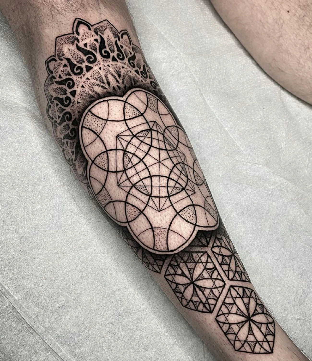 Geometric Tattoo Designs: Geometric tattoo designs incorporate symmetrical shapes and patterns to create visually striking and meaningful body art.