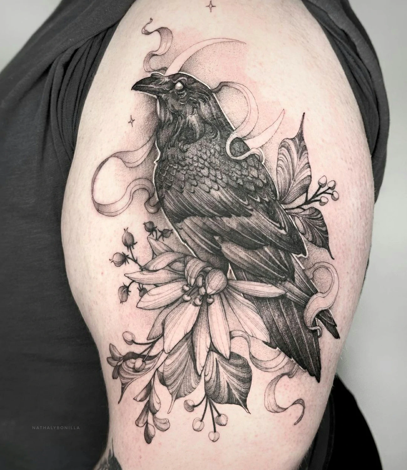 Raven arm tattoo: A versatile raven tattoo meant for placement on the arm.