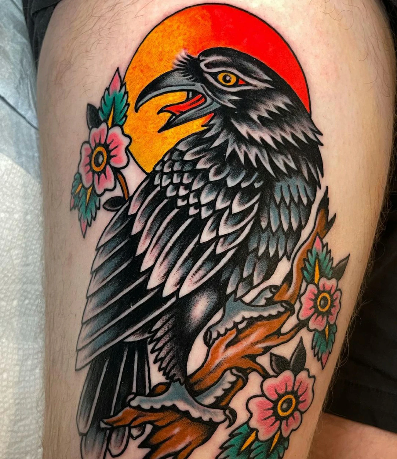 Raven traditional tattoo: A raven tattoo done in a traditional tattoo style.