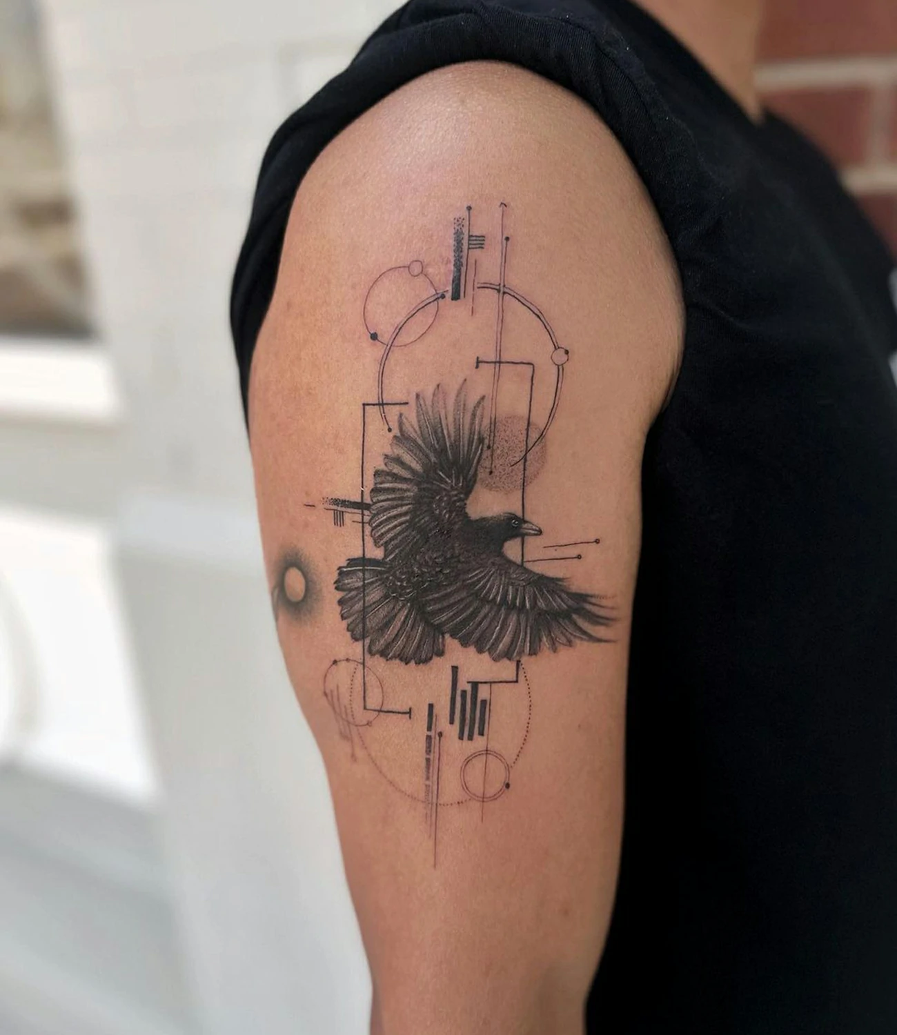 Geometric raven tattoo: A modern take on raven tattoos with geometric shapes and lines.