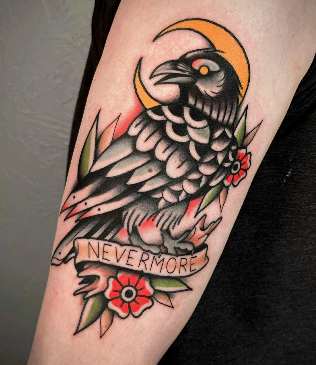 Trad raven tattoo: A raven tattoo done in a traditional style with bold lines and colors.