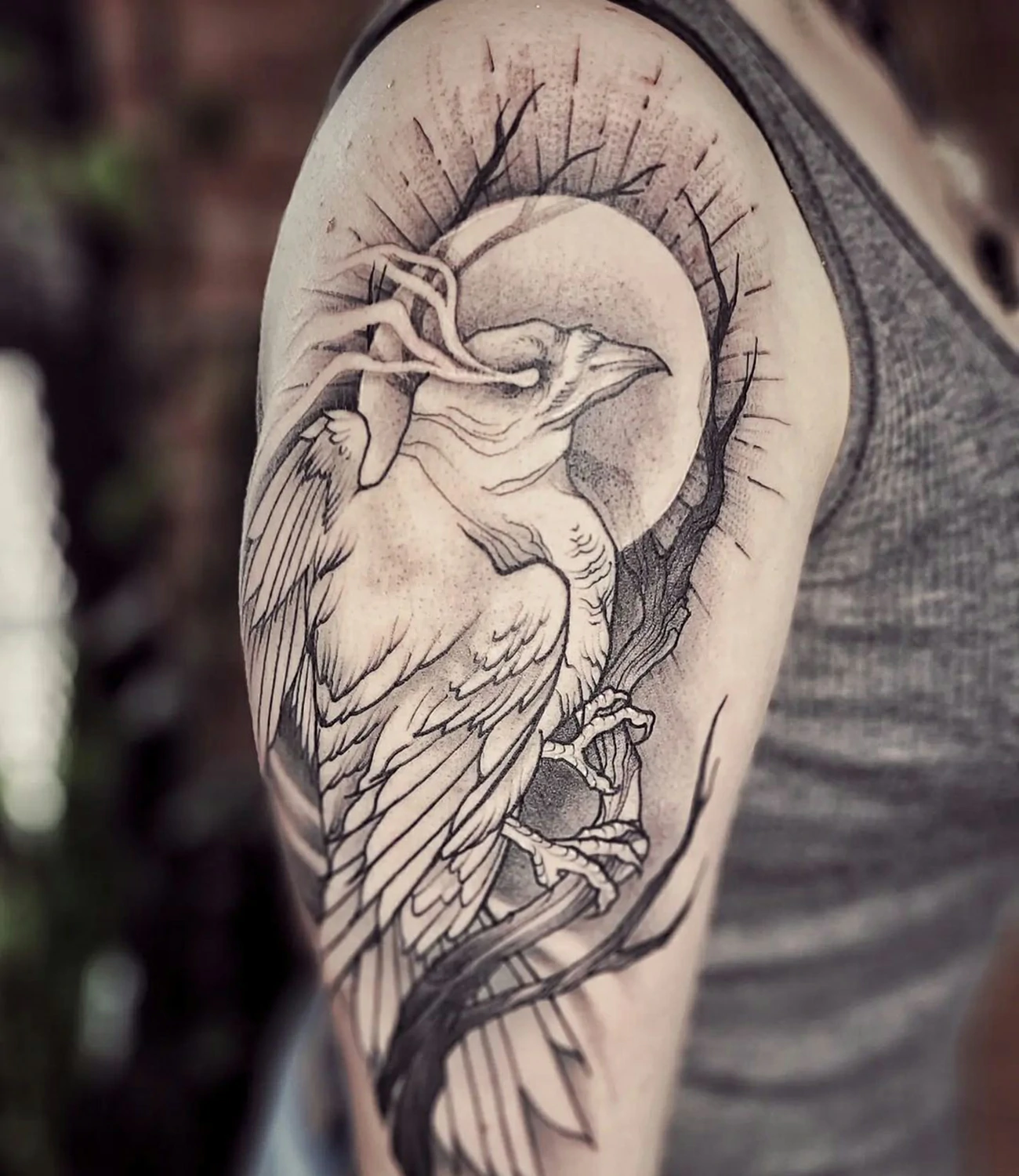 White raven tattoo: A unique twist with a raven tattoo depicted in white ink.