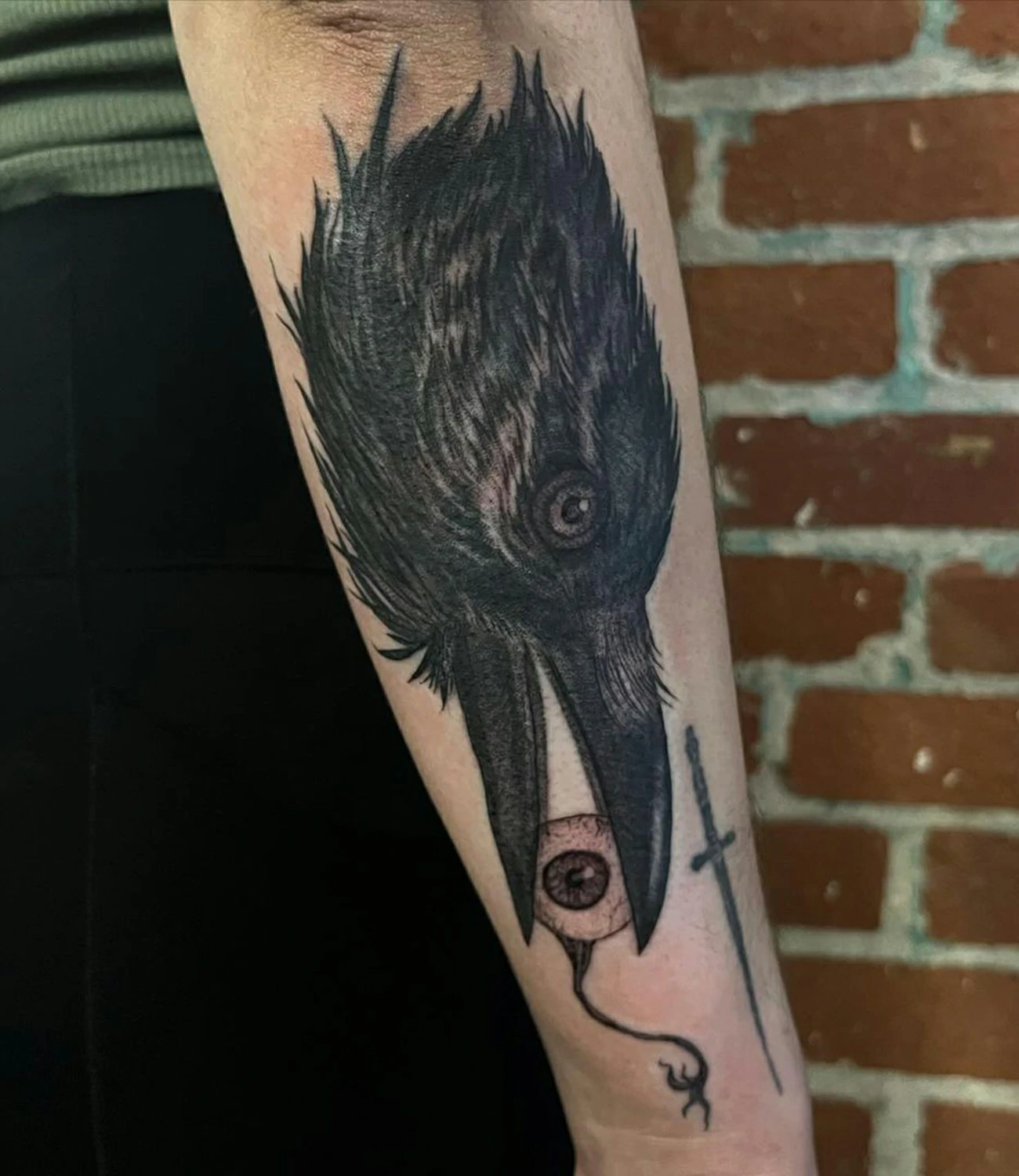 Raven head tattoo: A raven tattoo that prominently features the bird’s head.