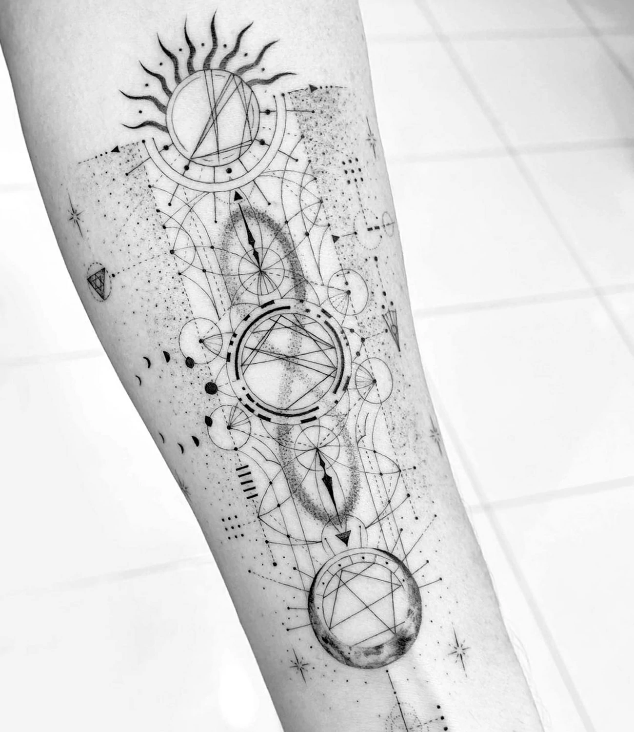geometric sun tattoo

