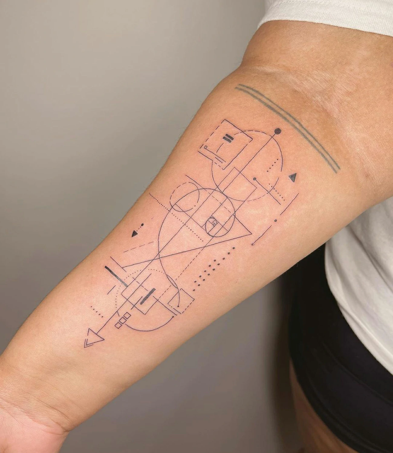 geometric fine line tattoos