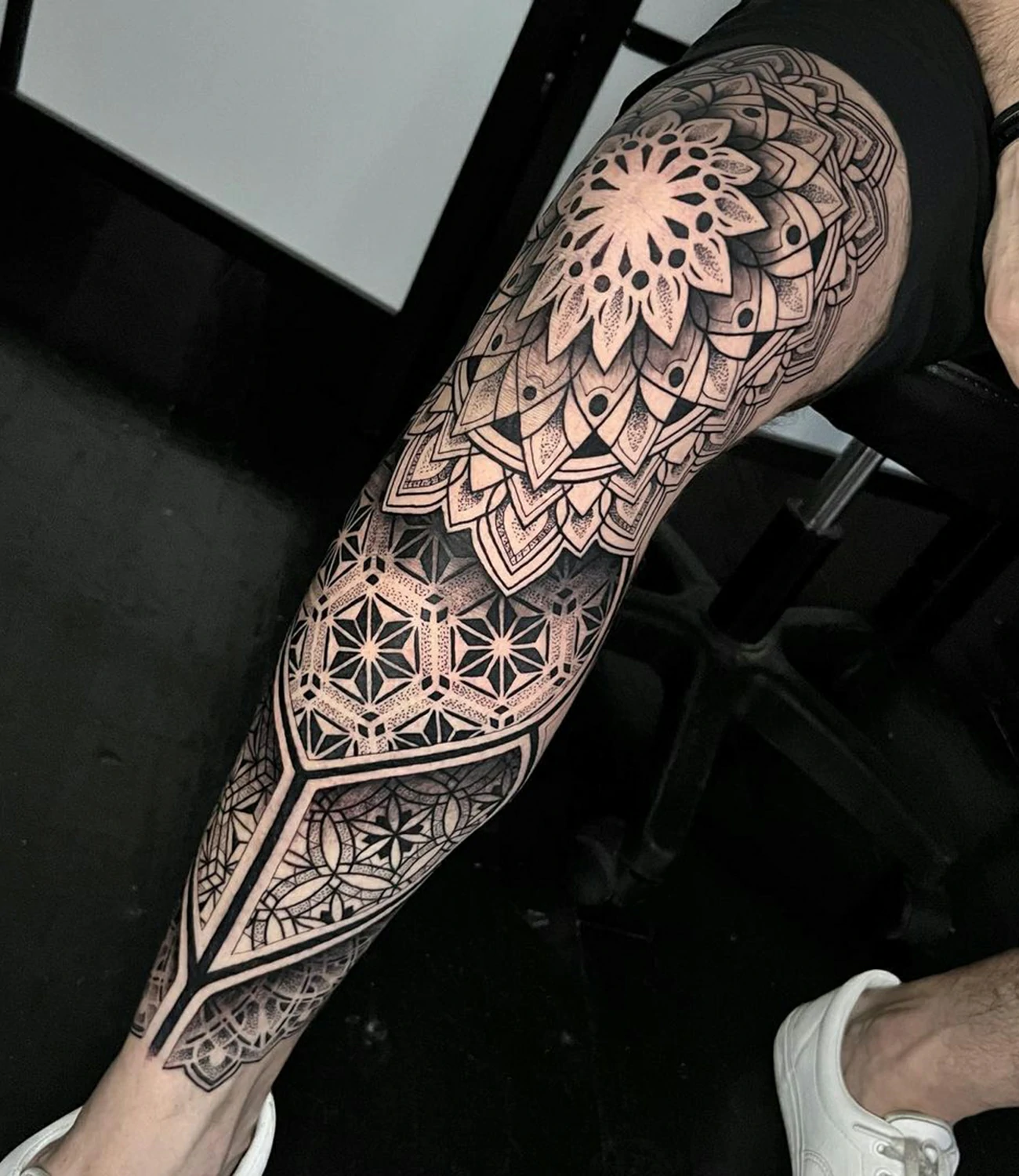 Geometric Leg Tattoo: Geometric leg tattoos cover the leg with intricate shapes and patterns, creating a visually appealing design.