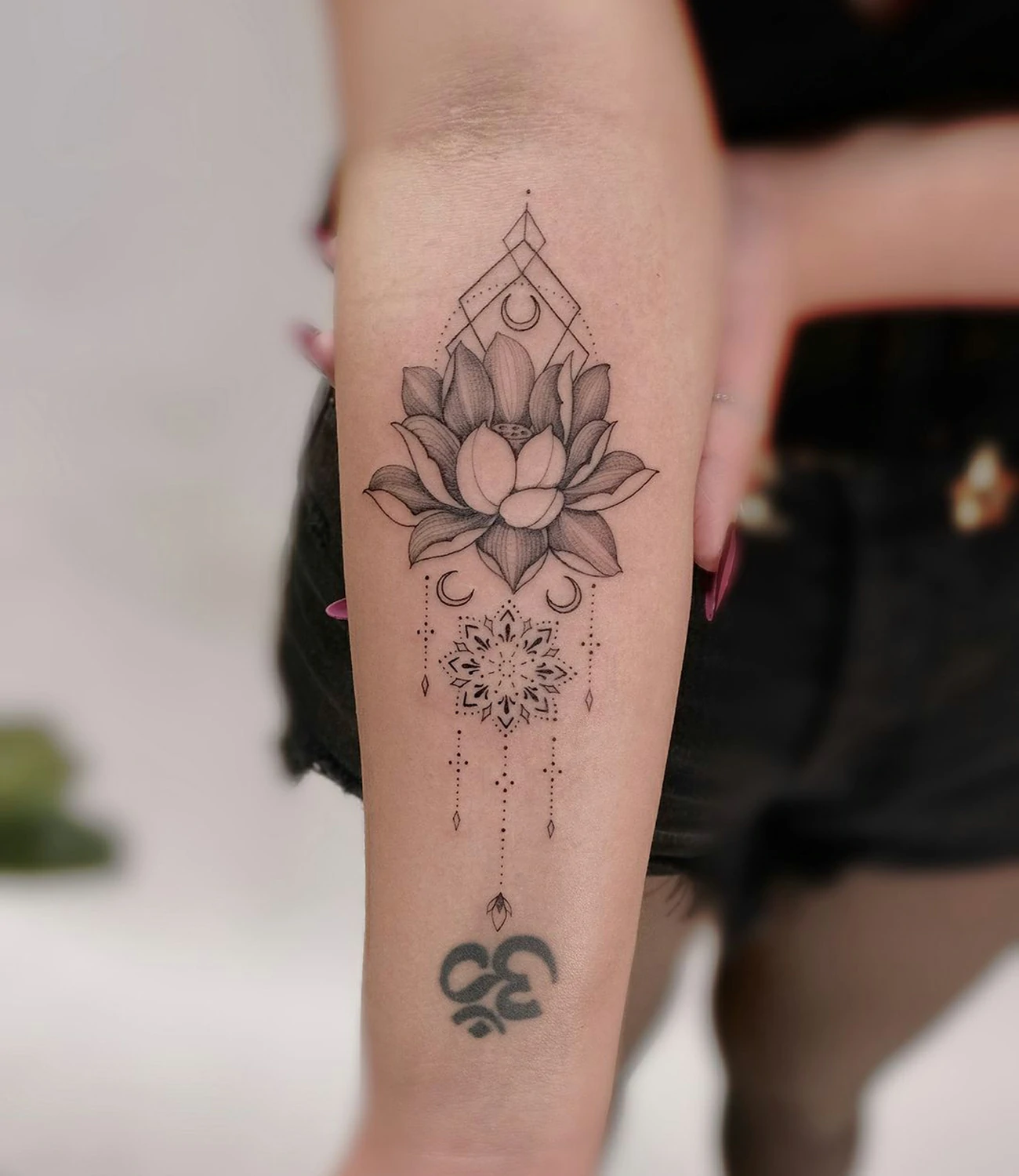 Geometric Lotus Tattoo: Geometric lotus tattoos blend the elegance of the lotus flower with geometric shapes, symbolizing purity and spiritual growth.