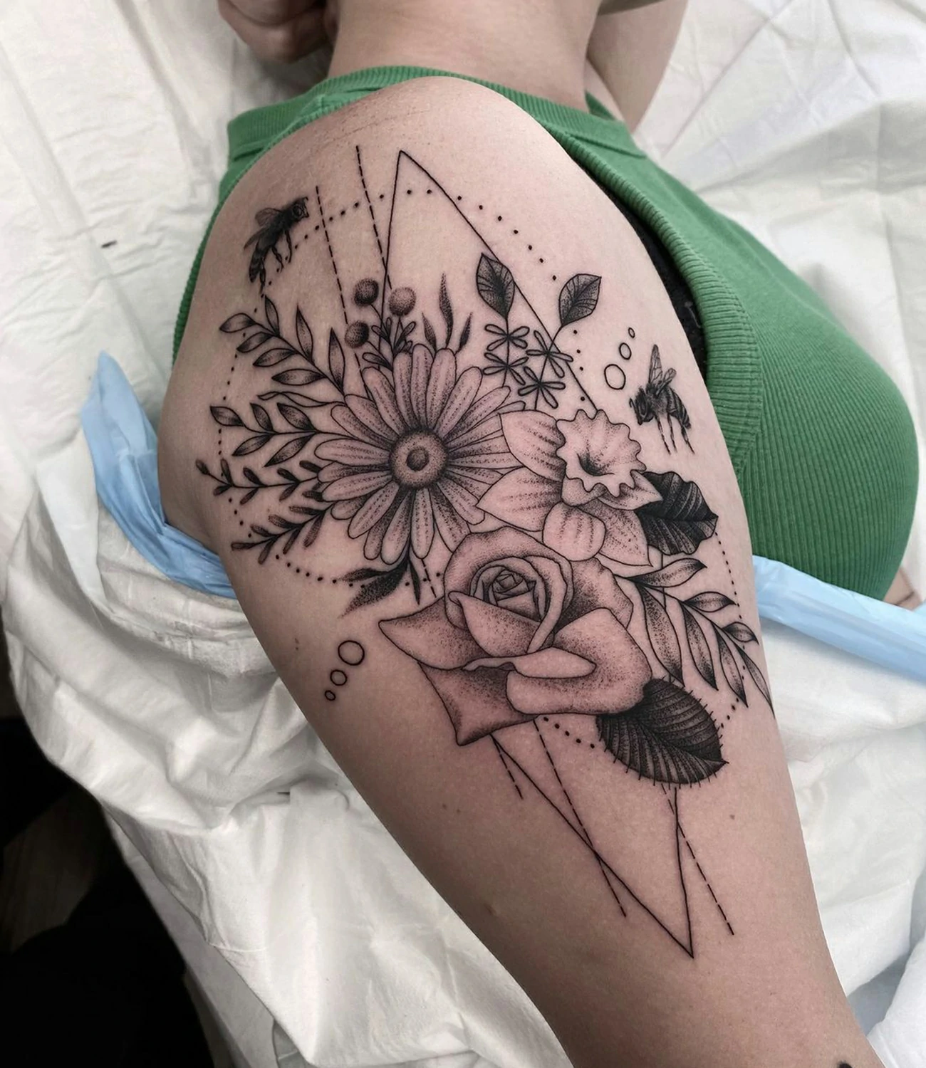 Geometric Flower Tattoo: Geometric flower tattoos blend natural beauty with geometric precision, symbolizing growth and the harmony of nature.