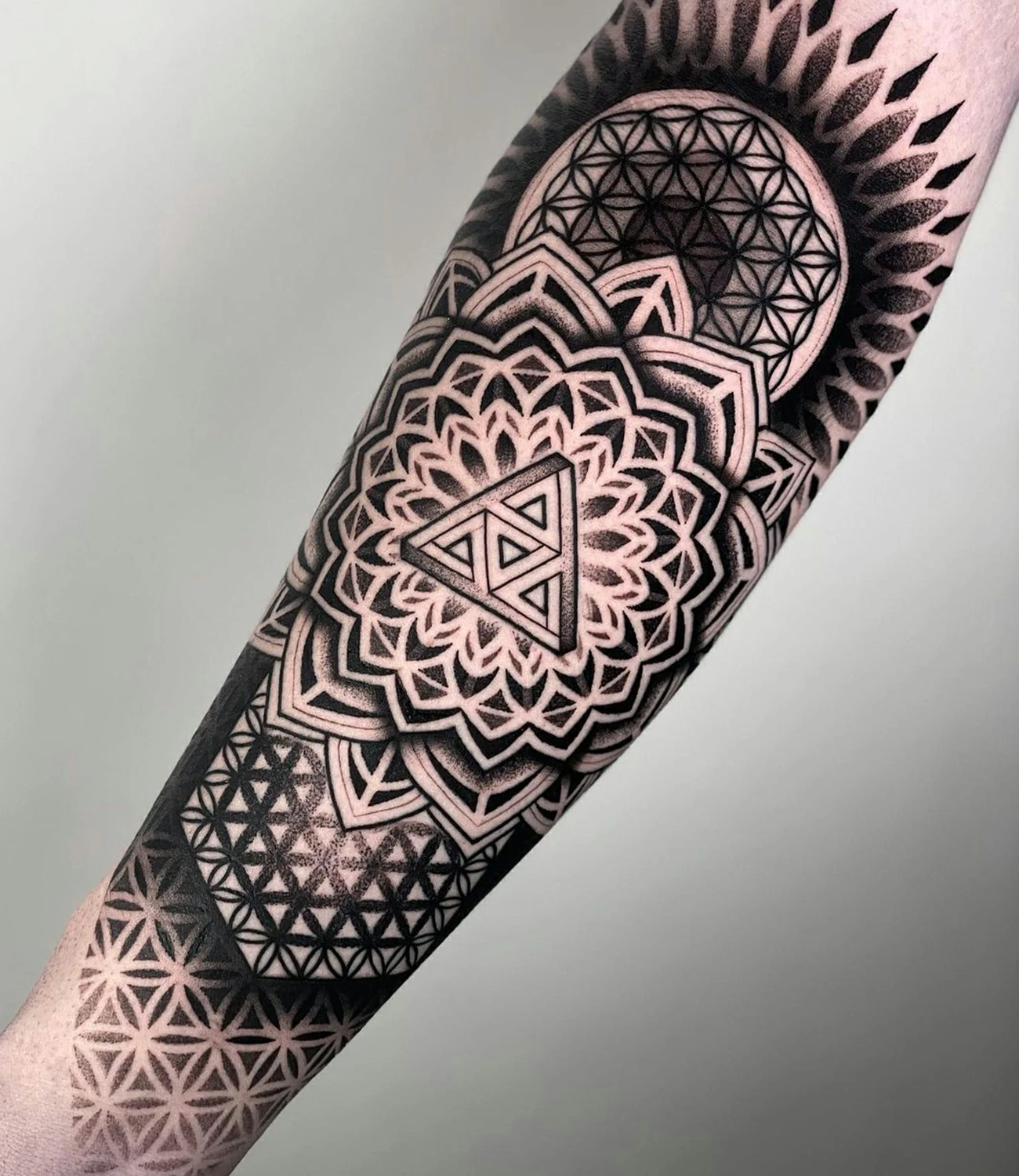 Geometric Tattoos for Men: Geometric tattoos for men emphasize bold and structured designs that reflect strength and symmetry.