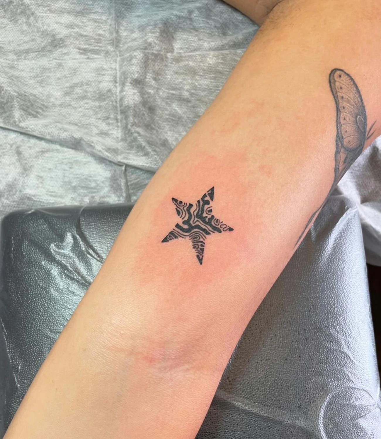 geometric star tattoo
