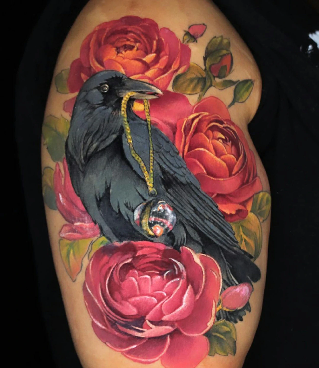 Raven and rose tattoo: A beautiful tattoo combining a raven with a rose.