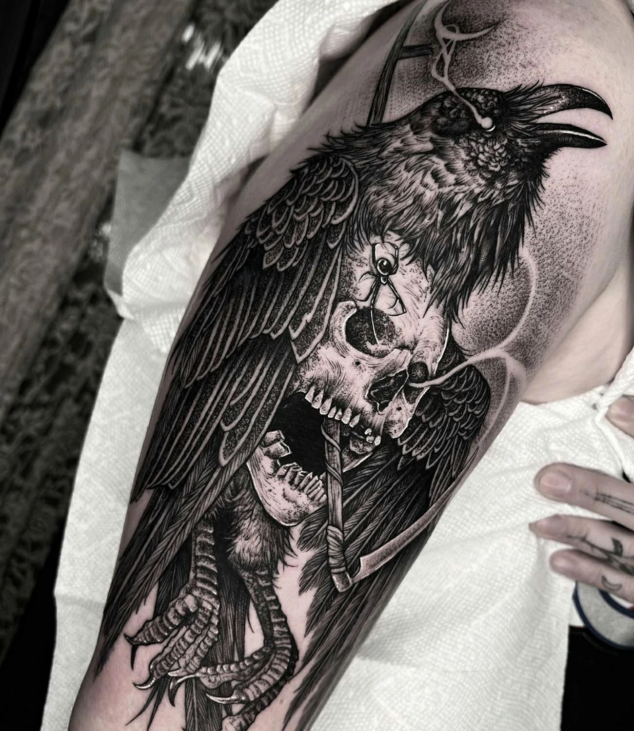 Gothic raven tattoo: A raven tattoo with gothic elements, creating a dark and mysterious vibe.