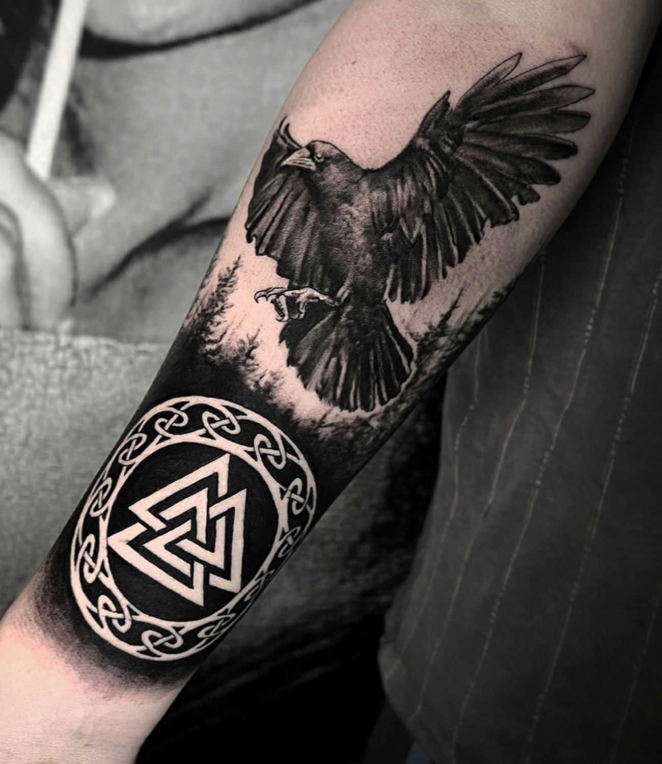 Raven viking tattoo: A combination of raven imagery with Viking symbols and motifs.
